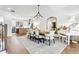 Elegant dining room with hardwood floors, a large table, and a modern chandelier at 3667 Peachtree, Atlanta, GA 30319