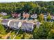Neighborhood aerial view of homes with mature trees and green lawns at 5845 Hampton Ct, Atlanta, GA 30349