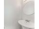 Bright bathroom with white pedestal sink and modern fixtures at 5845 Hampton Ct, Atlanta, GA 30349