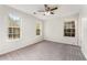 Well-lit bedroom with plush carpeting, neutral paint, and large windows for natural light at 5845 Hampton Ct, Atlanta, GA 30349