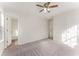 Spacious bedroom features plush carpeting, a ceiling fan, and multiple closets at 5845 Hampton Ct, Atlanta, GA 30349