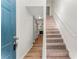 Inviting entryway with wood floors and staircase; the fireplace is visible in the background at 5845 Hampton Ct, Atlanta, GA 30349