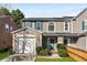 Charming townhome featuring an attached garage, well-kept lawn, and attractive landscaping at 5845 Hampton Ct, Atlanta, GA 30349