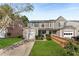 Charming townhome with attached garage, manicured lawn and tidy landscaping at 5845 Hampton Ct, Atlanta, GA 30349