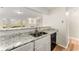 Open kitchen design with white cabinets, granite countertops, and stainless sink at 5845 Hampton Ct, Atlanta, GA 30349