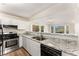 Modern kitchen featuring stainless steel appliances, stylish countertops and ample natural light at 5845 Hampton Ct, Atlanta, GA 30349
