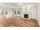 Spacious living room featuring wood floors, a fireplace and lots of natural light at 5845 Hampton Ct, Atlanta, GA 30349