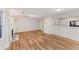 Open-concept layout offering wood floors, fireplace, and connection to kitchen for seamless living at 5845 Hampton Ct, Atlanta, GA 30349