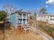 Two-story home with blue siding, front porch, and a driveway at 632 Warren Ave, Scottdale, GA 30079