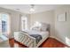 Spacious bedroom with hardwood floors and a ceiling fan at 169 Blue Creek Ln, Loganville, GA 30052