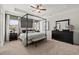 Spacious main bedroom with a four poster bed and dresser at 213 Bastian Dr # 6, Villa Rica, GA 30180