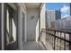 Balcony with black metal railing, offering city views and natural light at 390 17Th Nw St # 4063, Atlanta, GA 30363