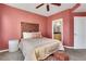 Comfortable bedroom with a unique wooden headboard and decorative pillows, creating a peaceful retreat at 390 17Th Nw St # 4063, Atlanta, GA 30363