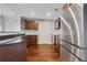 Kitchen featuring stainless steel appliances and dark wood cabinetry at 390 17Th Nw St # 4063, Atlanta, GA 30363