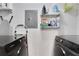 Laundry room featuring front load washer and dryer with shelving stocked with supplies at 390 17Th Nw St # 4063, Atlanta, GA 30363