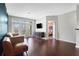 Spacious living room with hardwood floors, a modern sofa, and city views at 390 17Th Nw St # 4063, Atlanta, GA 30363