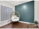 Cozy sitting area with a wicker chair near a window, creating a relaxing and inviting space at 390 17Th Nw St # 4063, Atlanta, GA 30363