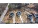 Aerial view of three new homes with driveways at 4410 Ross Estates Ct, Snellville, GA 30039