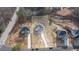 Aerial view of three new homes on a large lot at 4410 Ross Estates Ct, Snellville, GA 30039