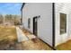 House exterior showcasing a modern design and walkway at 4410 Ross Estates Ct, Snellville, GA 30039