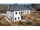 Two story house with white siding, deck and stairs at 4410 Ross Estates Ct, Snellville, GA 30039