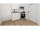 Small kitchen with white cabinets and granite counters at 4410 Ross Estates Ct, Snellville, GA 30039