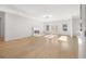 Sunlit living room with hardwood floors and fireplace at 4410 Ross Estates Ct, Snellville, GA 30039