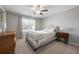 Bright bedroom with carpeted floor and ceiling fan at 2475 Barley Crest Pass, Cumming, GA 30040