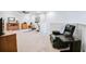 Spacious bonus room with ceiling fan and recliner at 2475 Barley Crest Pass, Cumming, GA 30040