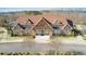 Beautiful clubhouse with stone accents, large windows, and manicured landscaping, creating an inviting community gathering space at 2475 Barley Crest Pass, Cumming, GA 30040
