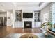 Open living space with fireplace and built-in shelving at 2475 Barley Crest Pass, Cumming, GA 30040