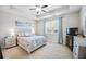 Main bedroom with large window, ceiling fan, and ample space at 2475 Barley Crest Pass, Cumming, GA 30040