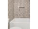 Clean bathroom with a shower/tub combo and gray tile at 702 Fairgate Rd, Marietta, GA 30064