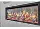 Modern linear fireplace with a glass front and realistic flame effect at 702 Fairgate Rd, Marietta, GA 30064