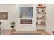 Living room with modern linear fireplace and built-in shelving at 702 Fairgate Rd, Marietta, GA 30064