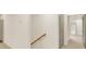 Long hallway with light gray doors and neutral colored carpet at 702 Fairgate Rd, Marietta, GA 30064