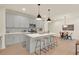 Modern kitchen with gray cabinets, white countertops, and stainless steel appliances at 702 Fairgate Rd, Marietta, GA 30064