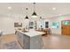 Open concept kitchen with island, living area, and hardwood floors at 702 Fairgate Rd, Marietta, GA 30064