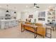 Open concept living area with a modern kitchen, island, and tan leather couch at 702 Fairgate Rd, Marietta, GA 30064