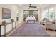 Main bedroom with a ceiling fan, large windows and sitting area at 702 Fairgate Rd, Marietta, GA 30064