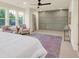 Main bedroom with a sitting area and large windows at 702 Fairgate Rd, Marietta, GA 30064