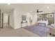 Spacious main bedroom with a sitting area and ceiling fan at 702 Fairgate Rd, Marietta, GA 30064