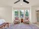 Sitting area in main bedroom with two armchairs and a rug at 702 Fairgate Rd, Marietta, GA 30064