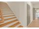 Clean staircase with light wood steps and white risers at 702 Fairgate Rd, Marietta, GA 30064