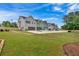 Row of three-story townhomes with attached garages at 702 Fairgate Rd, Marietta, GA 30064