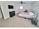 Main bedroom with a queen bed, TV, and dresser at 208 Willows Ct, Riverdale, GA 30274