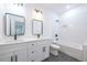 Modern bathroom with white subway tile, double vanity, and bathtub at 5649 Eagles Watch, Douglasville, GA 30135