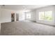 Large bedroom with grey carpet and ensuite bathroom at 5649 Eagles Watch, Douglasville, GA 30135