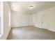 Large bedroom with neutral walls and carpet, plus an additional door at 5649 Eagles Watch, Douglasville, GA 30135