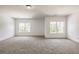 Spacious bedroom with grey carpet and large windows at 5649 Eagles Watch, Douglasville, GA 30135